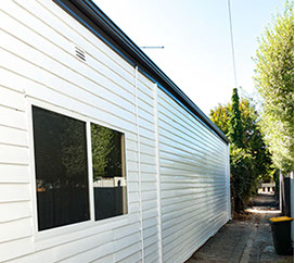 Repainted weatherboard wall