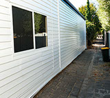 Repainted weatherboard wall